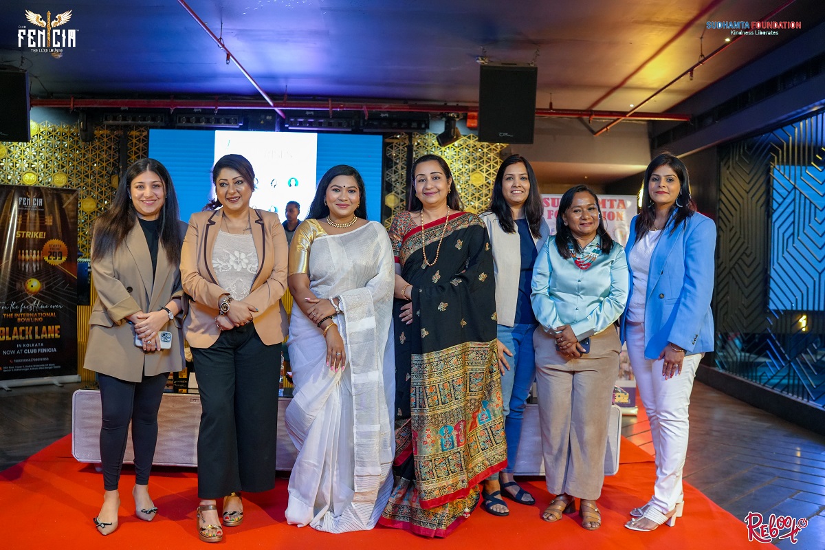 Women from the SAHAARA community standing together at a Kolkata event